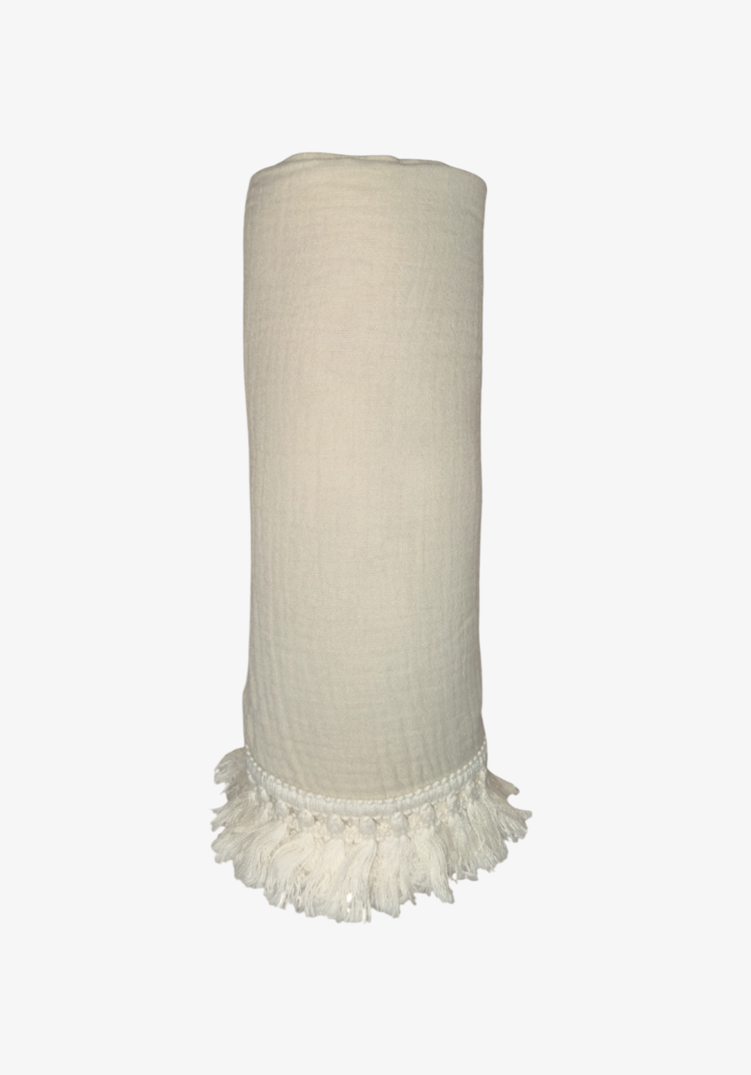 Rolled neutral-colored organic cotton baby blanket with white tassel fringe, displayed upright against a white background.