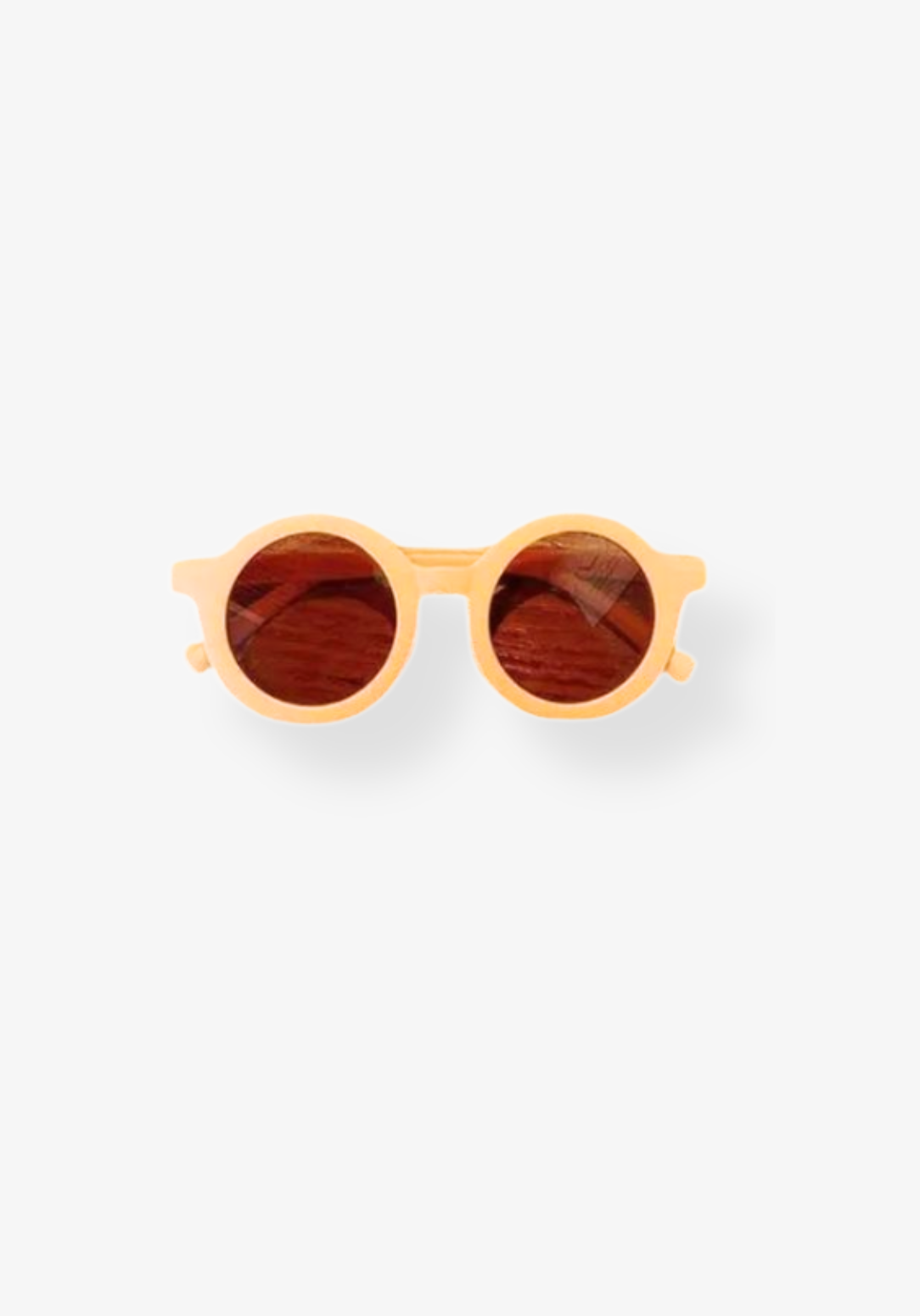 Neutral apricot beige toddler sunglasses with round dark lenses and soft curved arms.