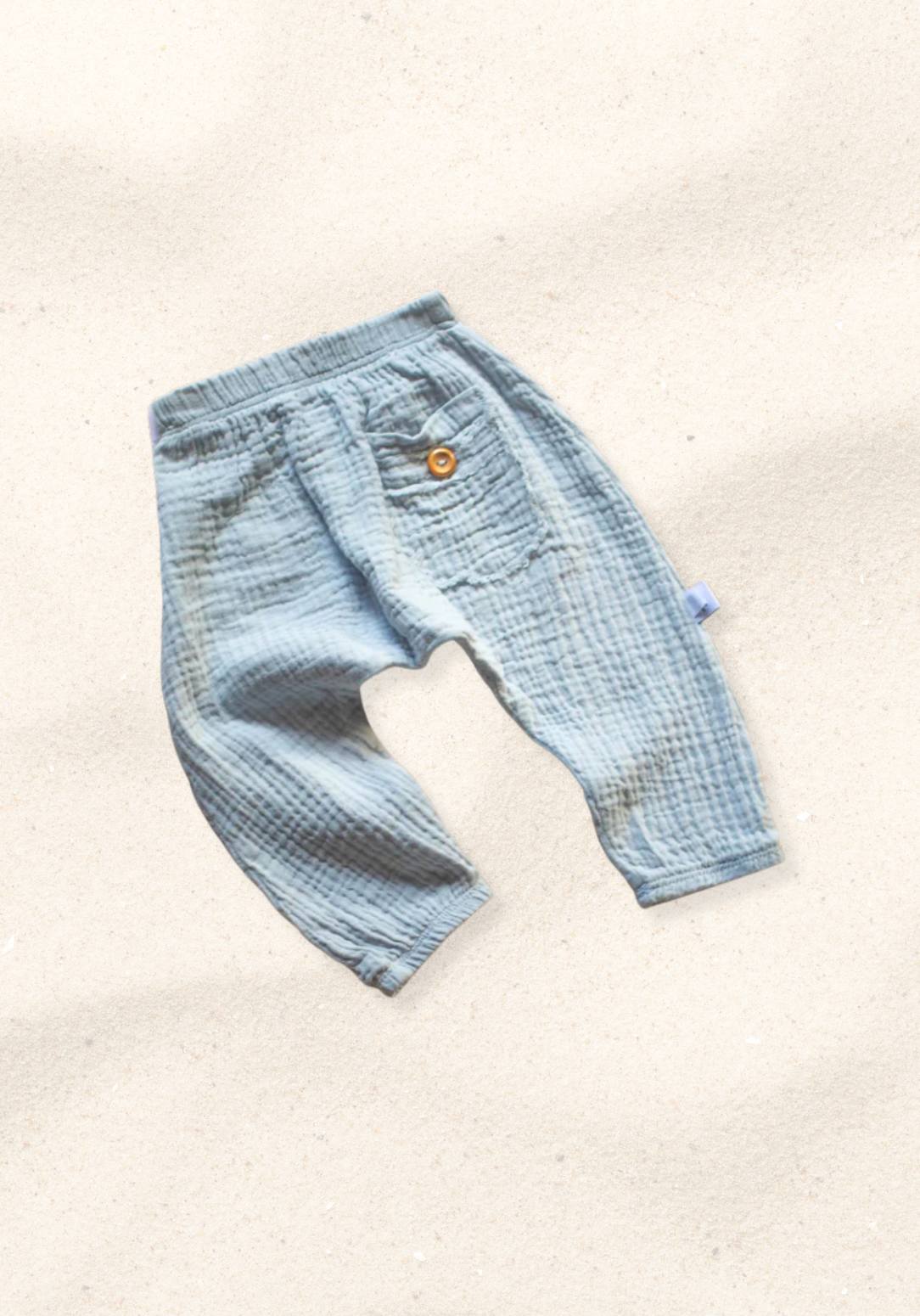 French grey organic cotton toddler harem pants with elastic waistband, wooden button, and back pocket