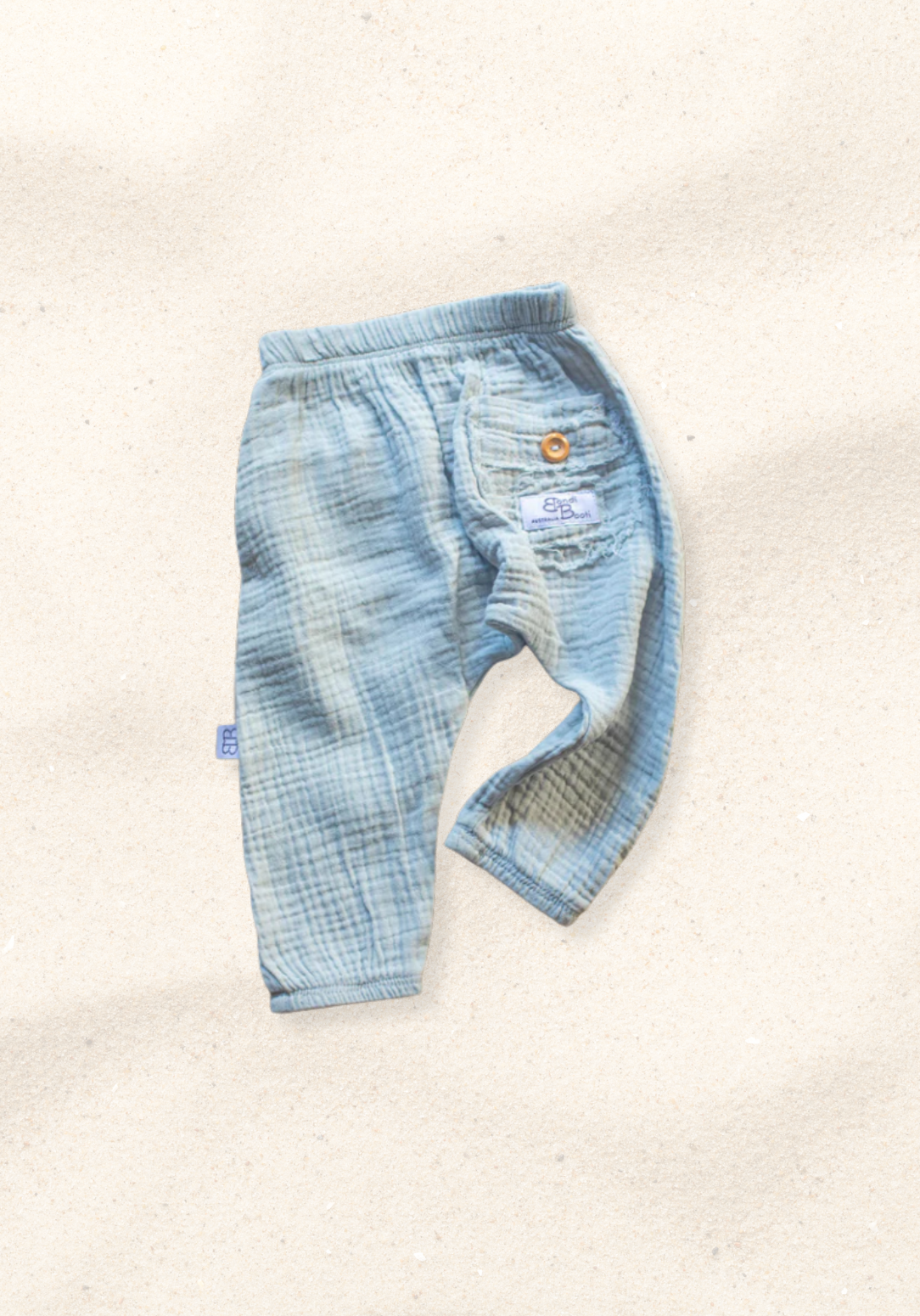 French grey organic cotton toddler harem pants with elastic waistband, wooden button, and back pocket