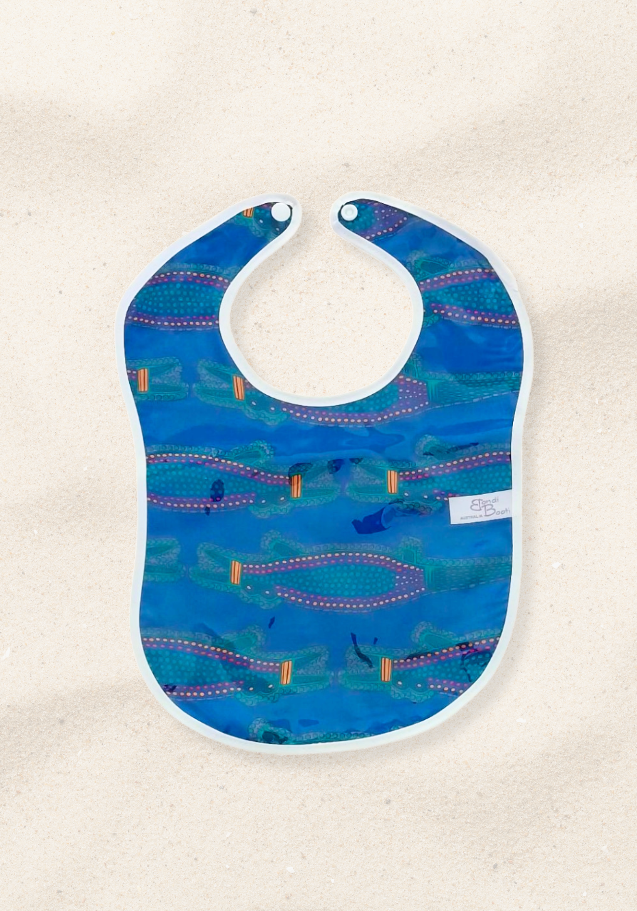 Laminated baby bib with playful alligator print