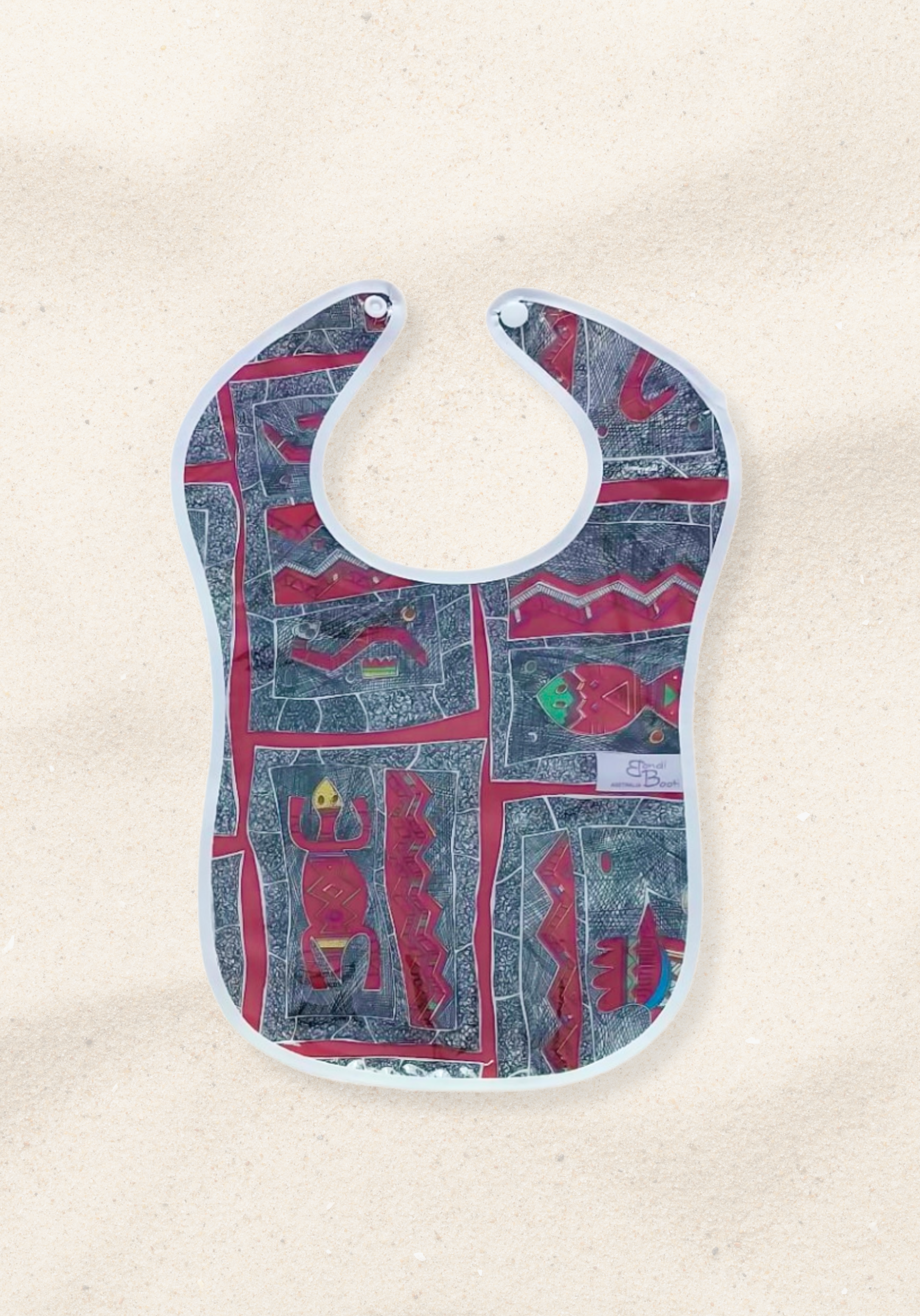 Laminated baby bib with red Aboriginal-inspired design