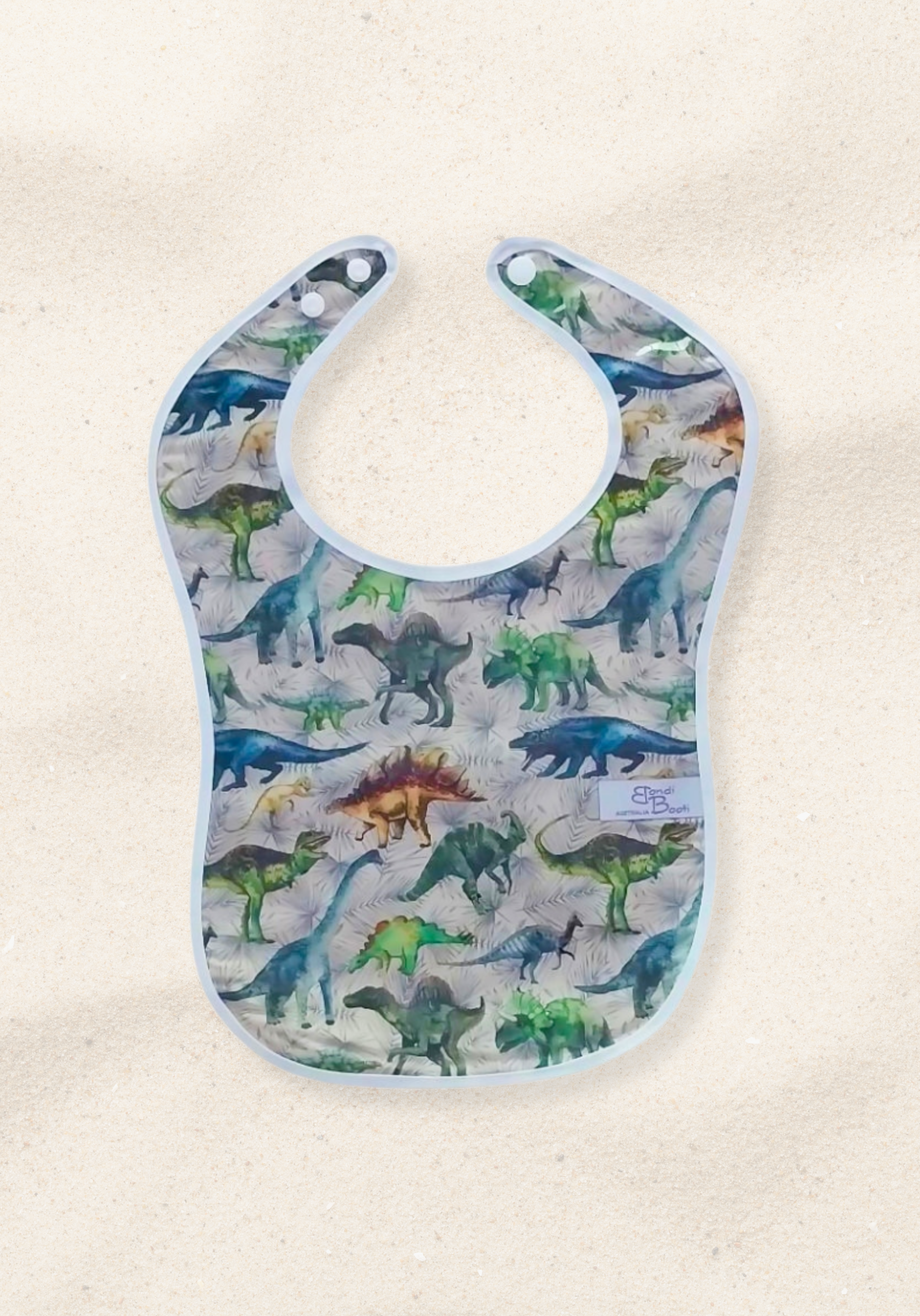 Laminated baby bib with colourful dinosaur print