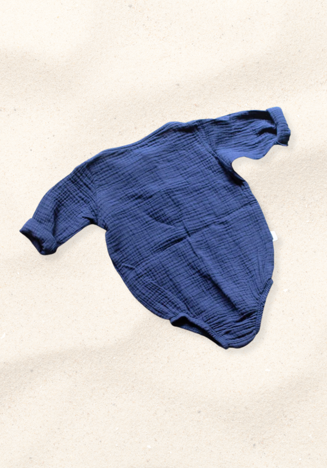 Long sleeve navy baby romper crafted from soft organic cotton with button-up front