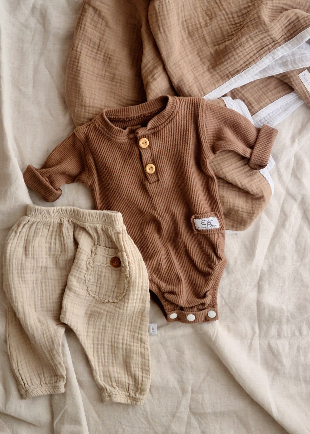 Brown beige neutral baby romper clothing australia