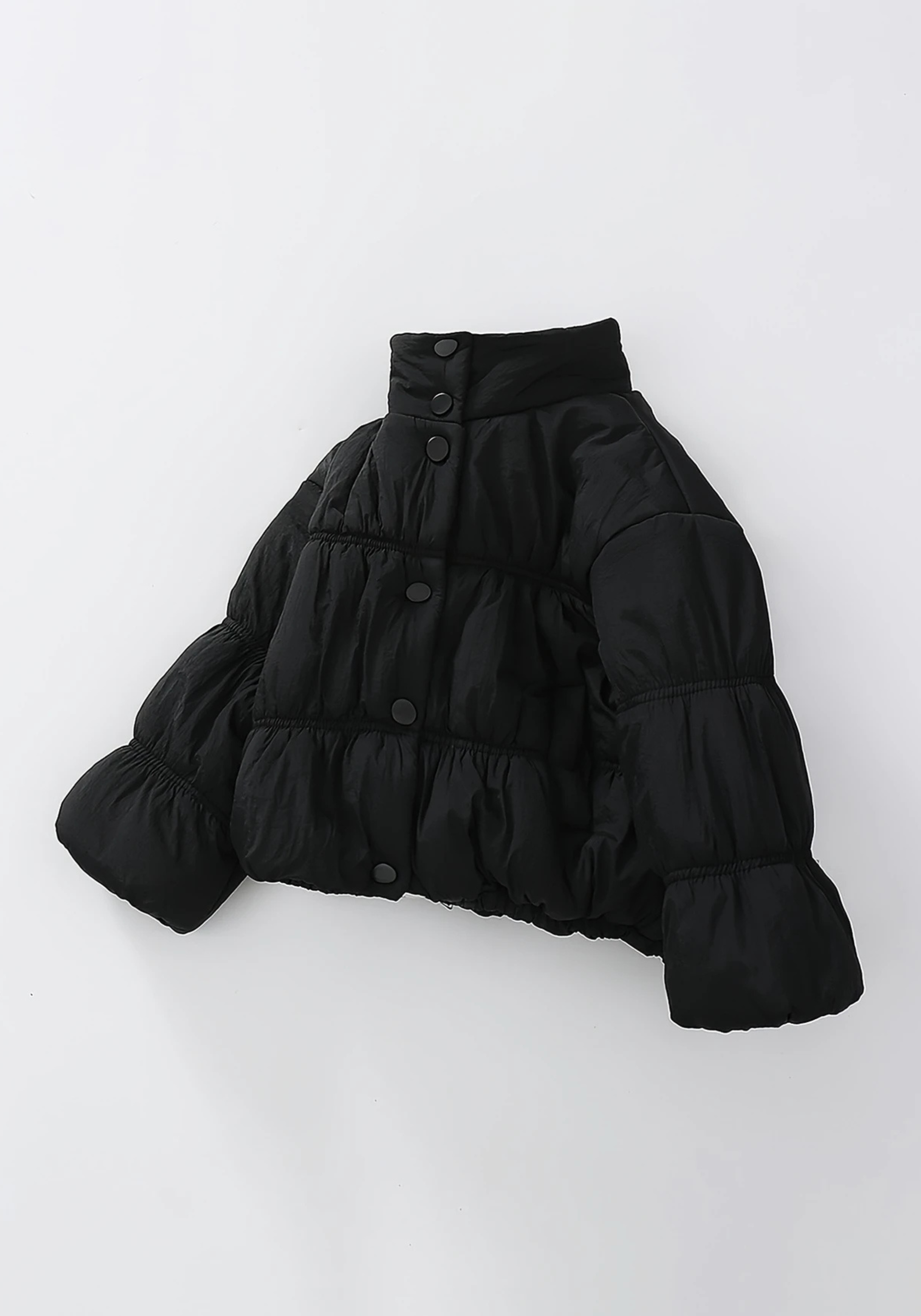 Front view of toddler black puffer jacket with ruched detailing and high collar