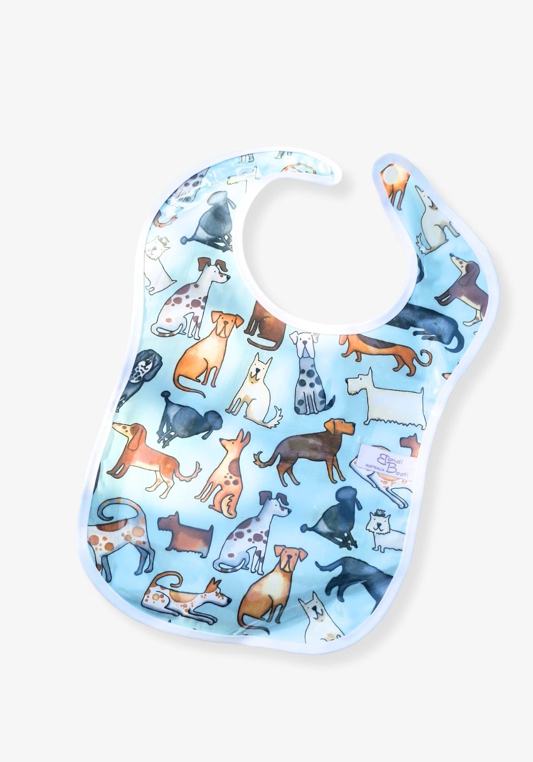 Laminated baby feeding bib featuring a playful pattern of illustrated dogs in various breeds and colors on a light blue background, trimmed in white with a snap closure, laid flat on a grey background.