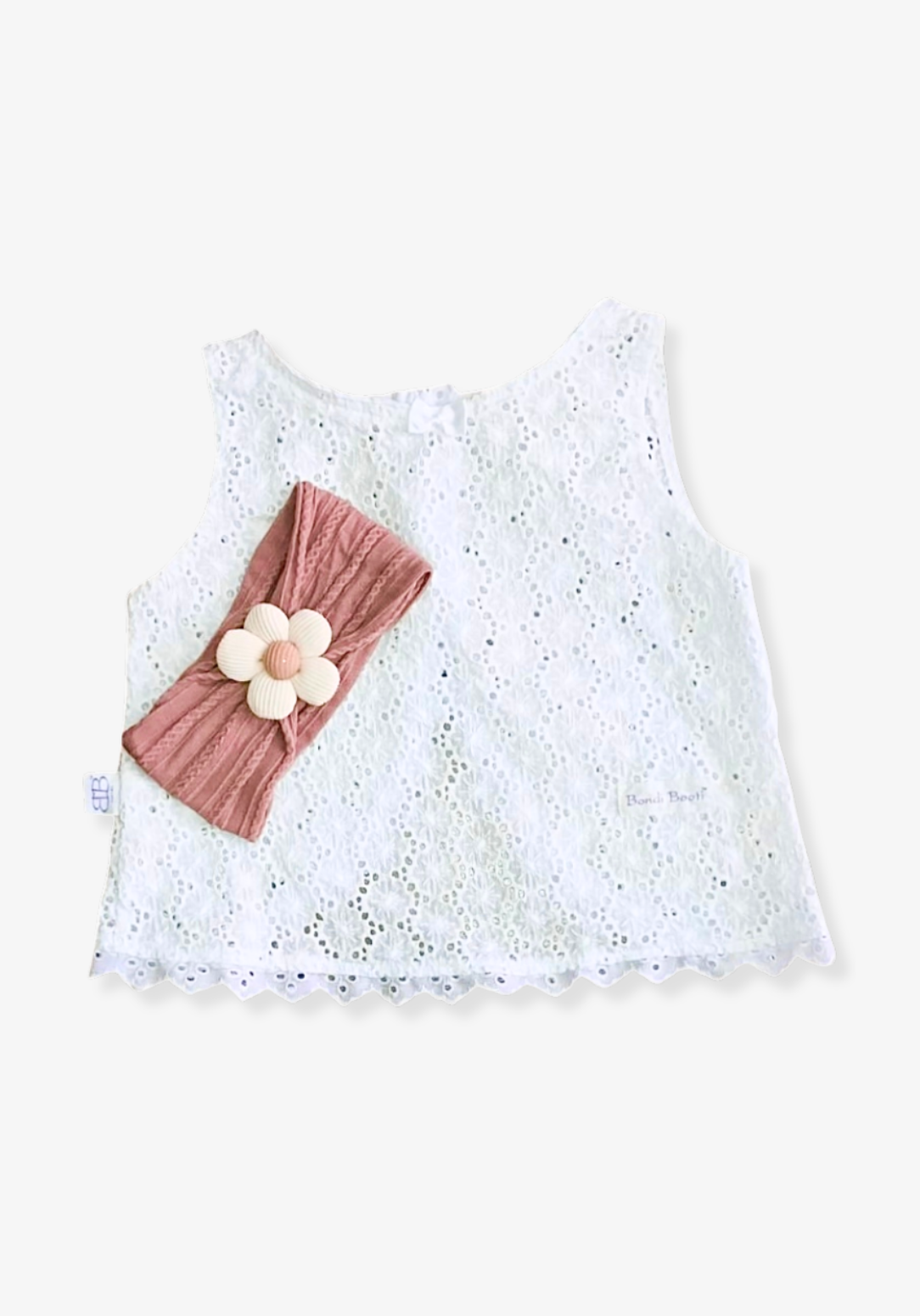 Rust toddler head band with a soft fabric daisy embellishment in the center.