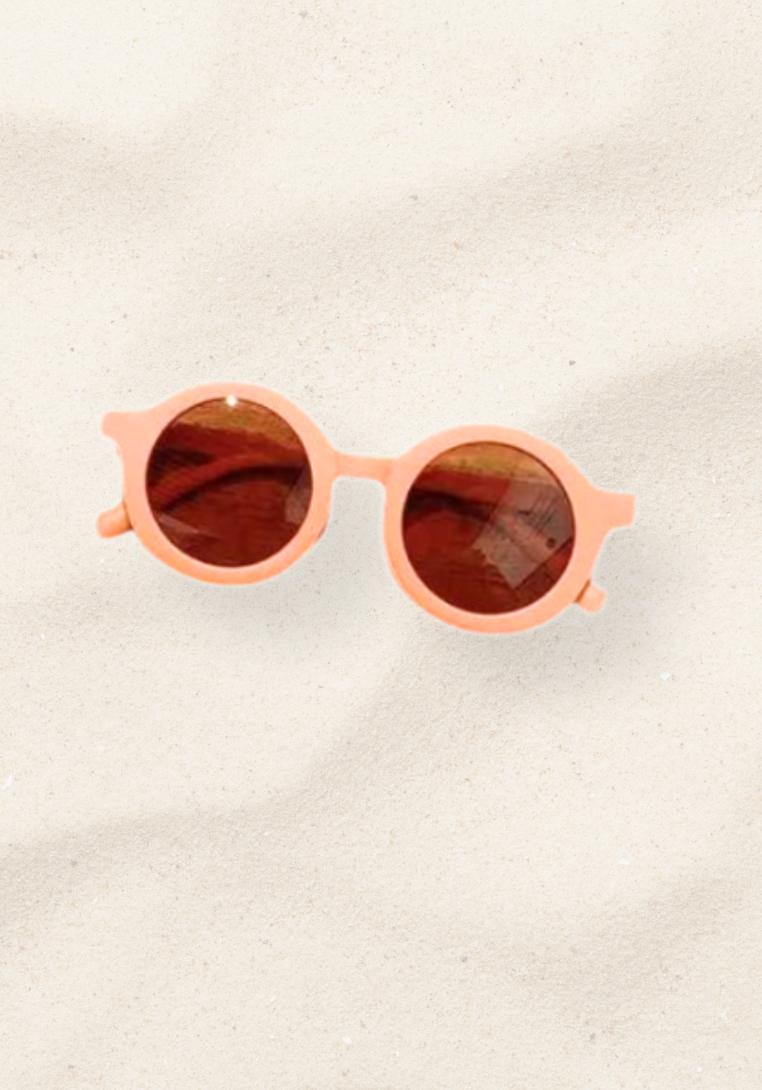 Playful peach pop toddler sunglasses with brown round lenses and bright tone frame.