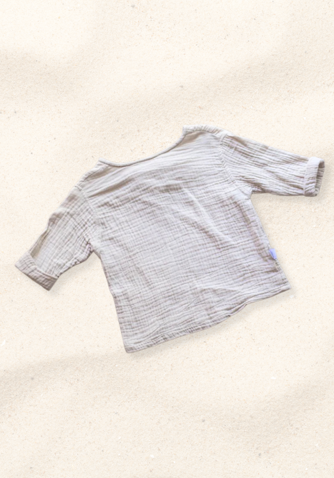 Beige long sleeve baby pirate shirt made from organic cotton with soft gathered neckline