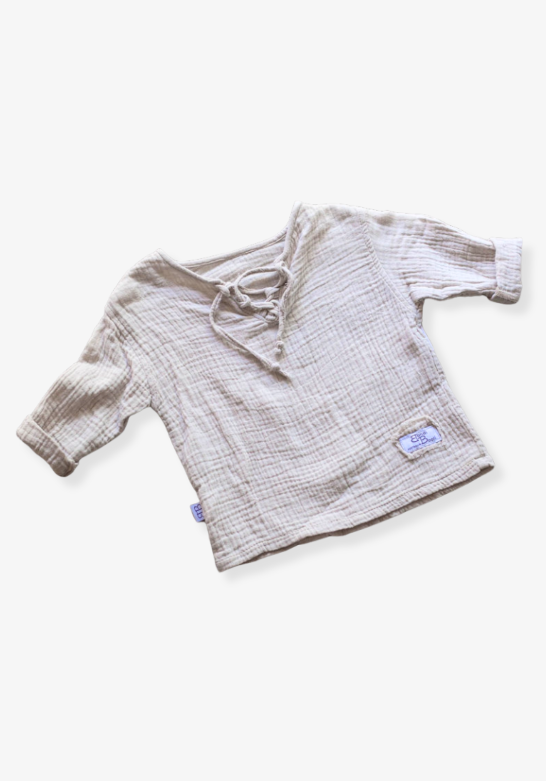 Beige long sleeve baby pirate shirt made from organic cotton with soft gathered neckline