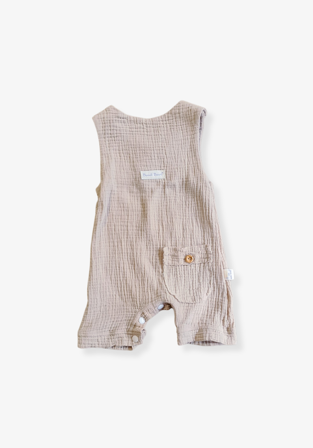 Beige organic cotton baby overall onesie with wooden button straps and soft elastic leg openings