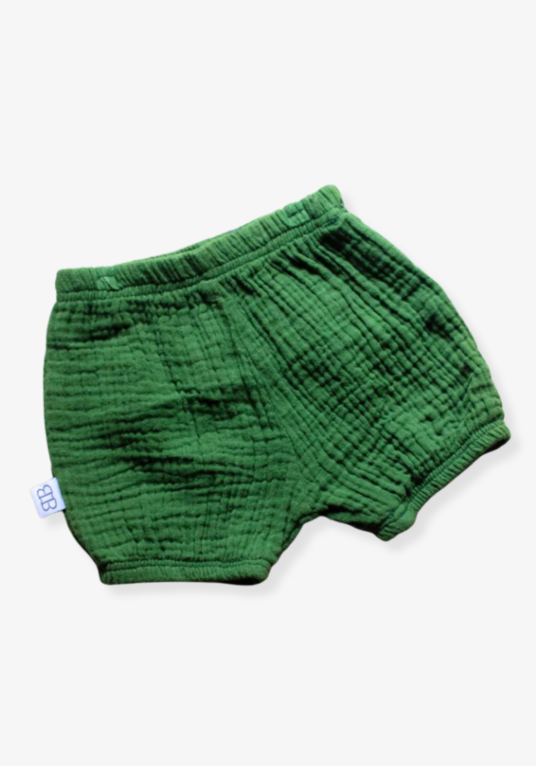 Deep green baby bloomers made from soft organic cotton with stretchy waistband, displayed on a grey background