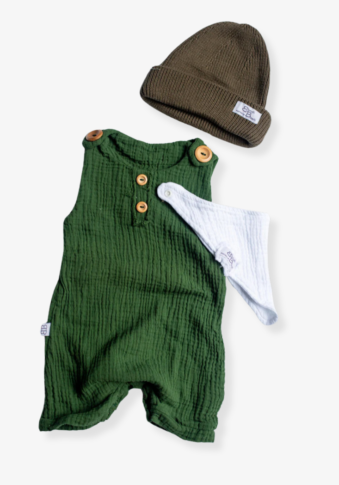 Baby romper in deep green organic cotton with overall-style wooden button straps