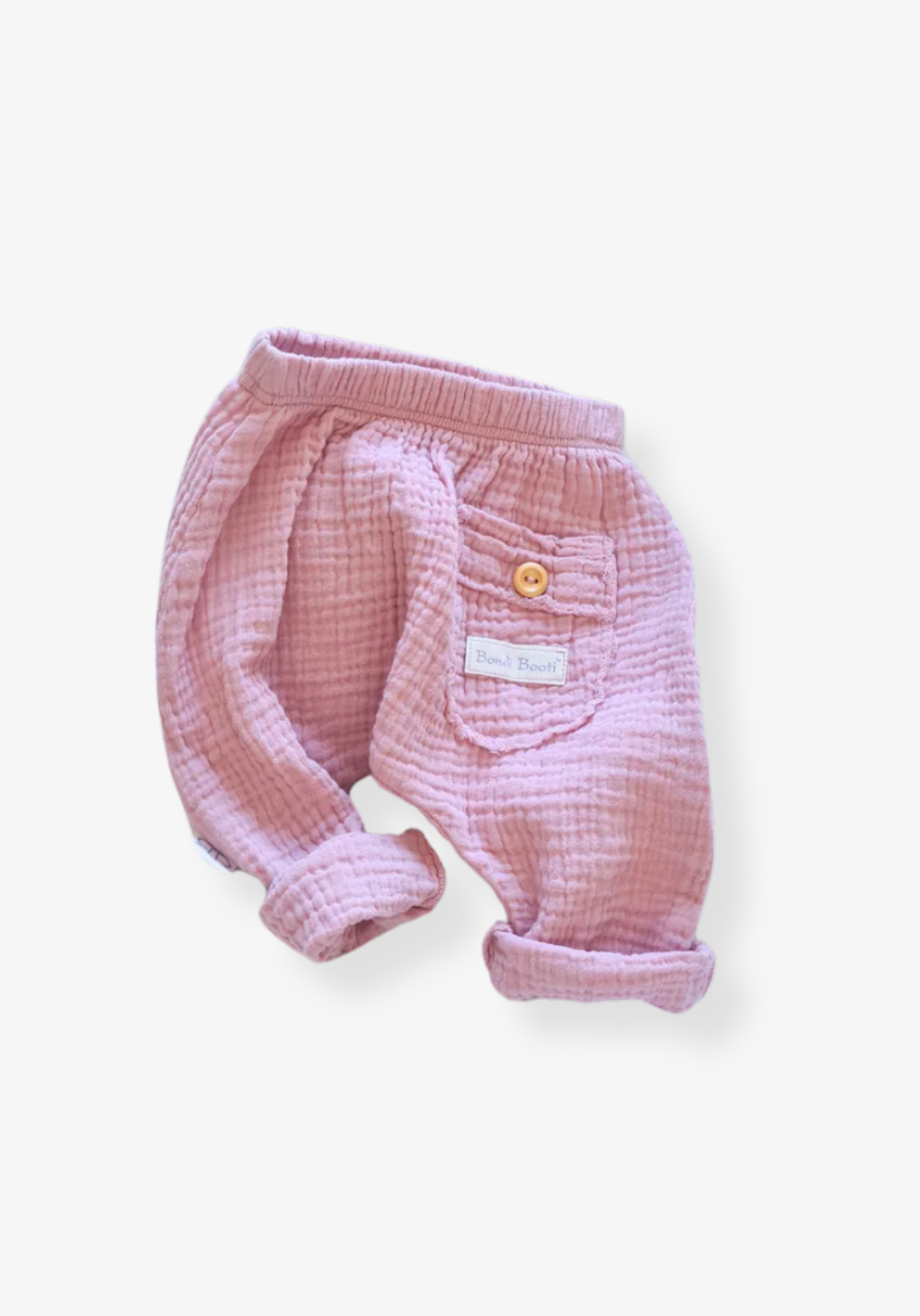 Organic cotton toddler harem pants in dusty pink with soft, breathable fabric and elastic cuffs.
