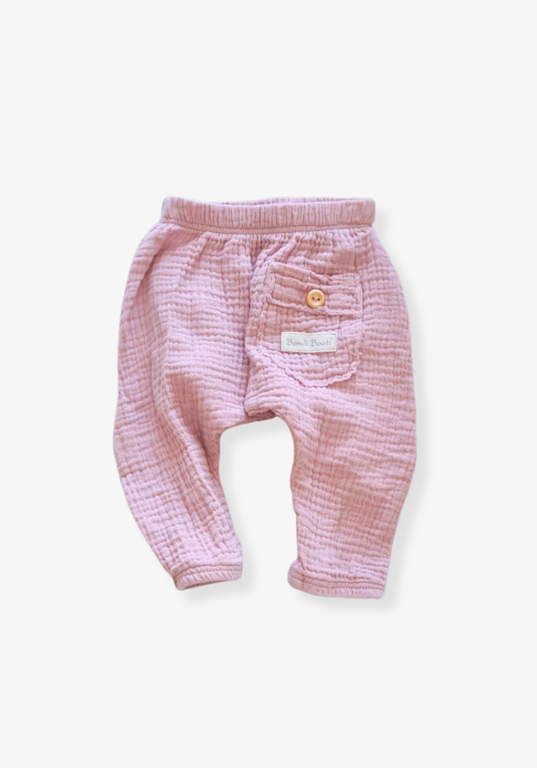 Organic cotton toddler harem pants in dusty pink with soft, breathable fabric and elastic cuffs.