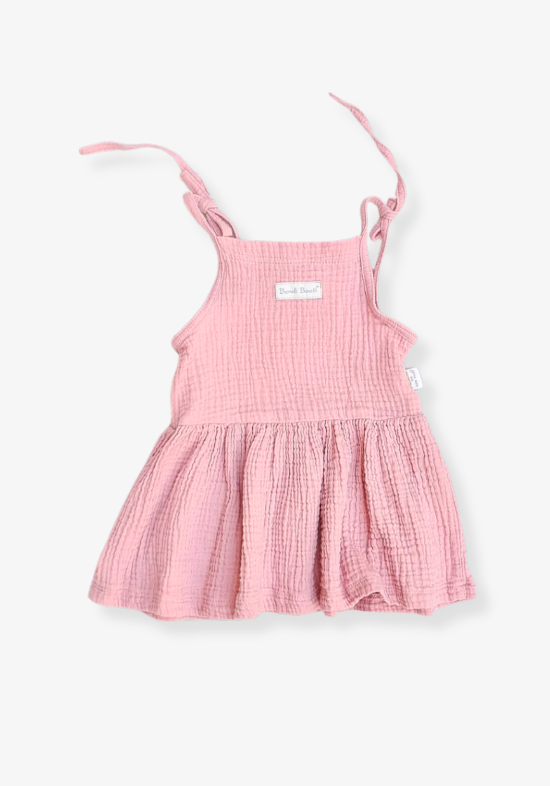 Dusty pink cotton baby dress styled for picnics with flutter sleeves and soft gathered fabric, displayed on a grey background