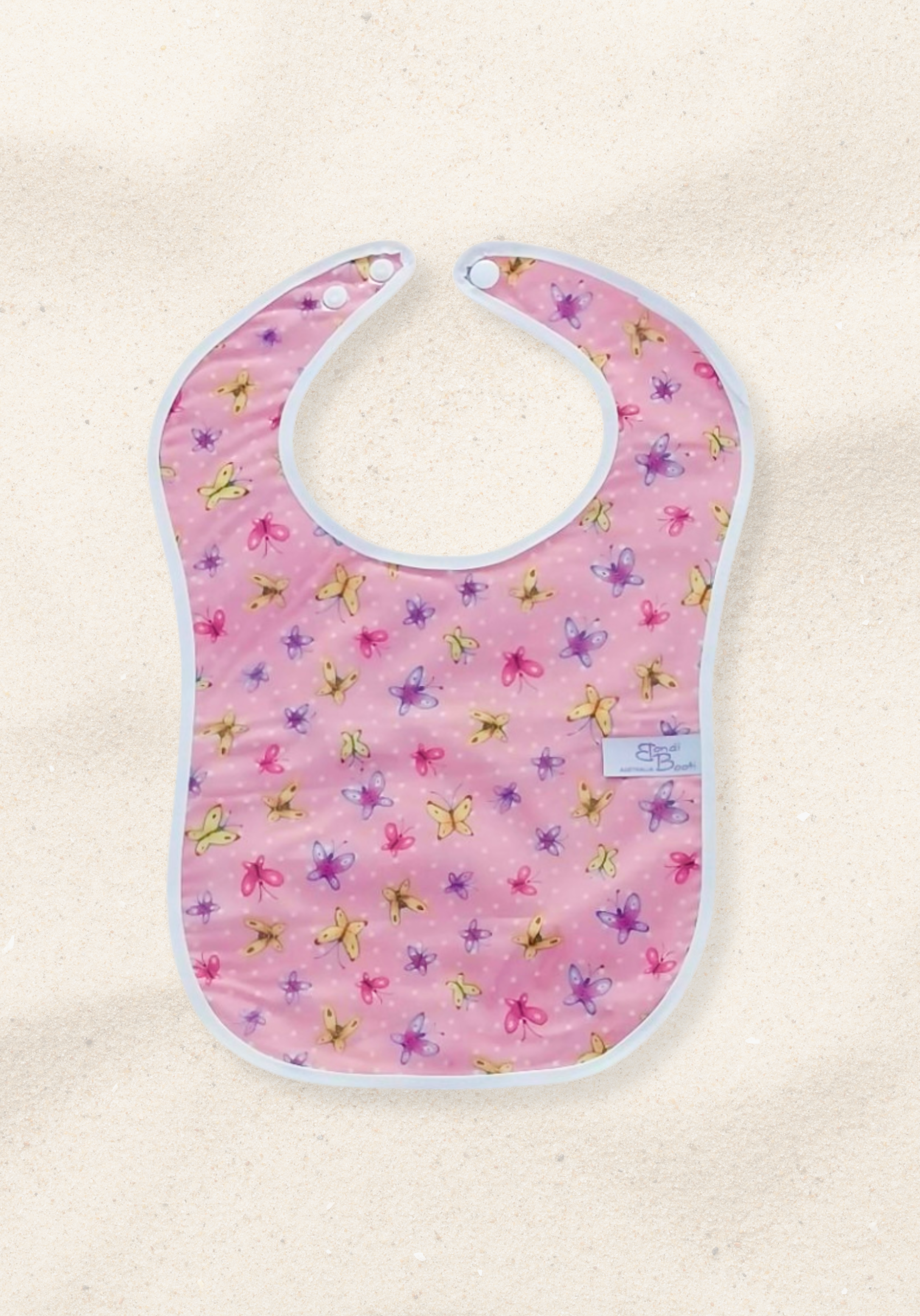 Laminated baby bib with pink background and butterfly print