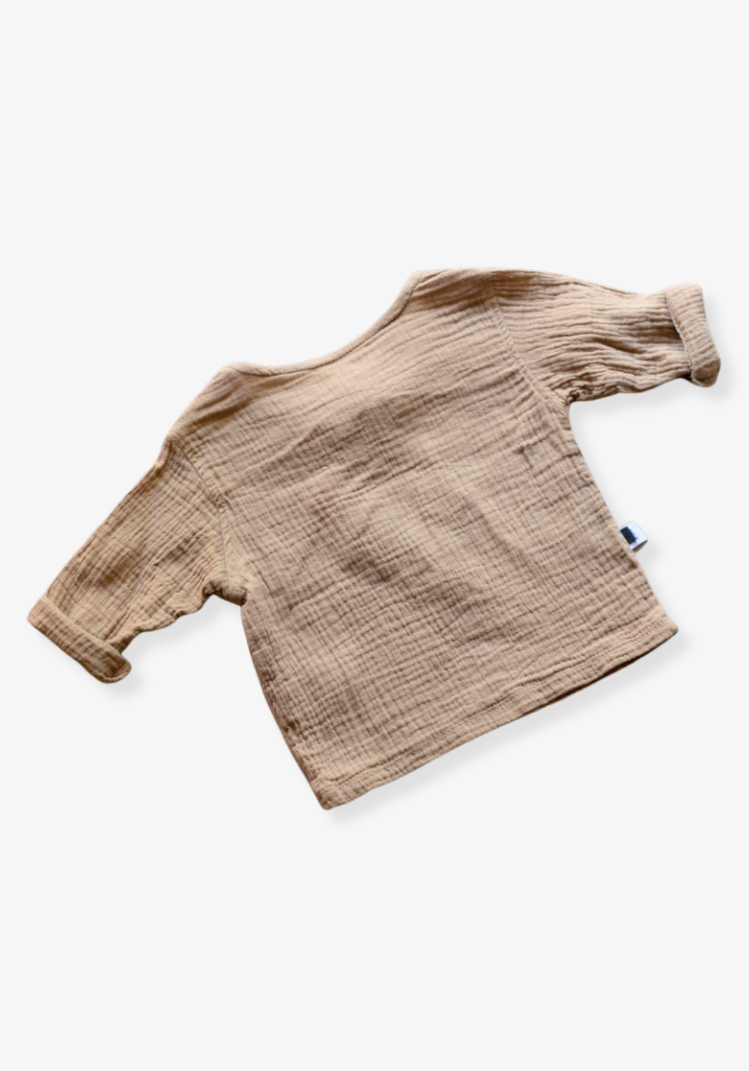 Mocha baby shirt in pirate style with soft cotton muslin fabric and wooden button details, displayed on a grey background