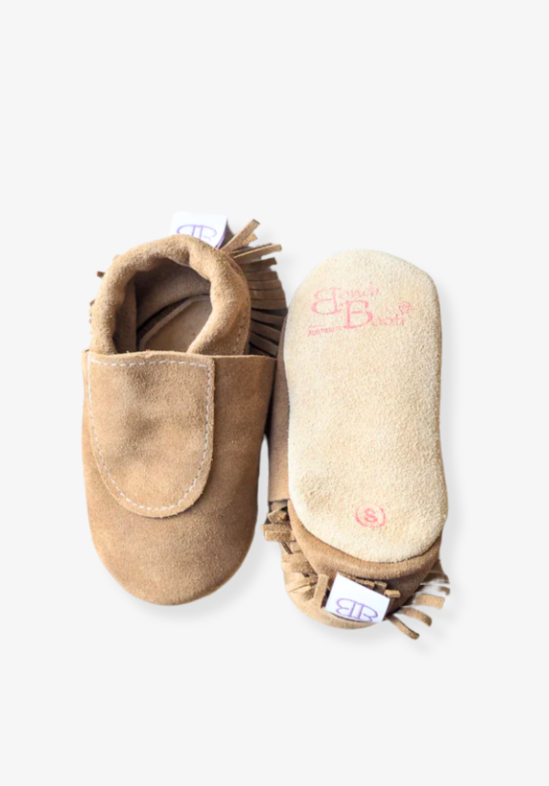 Soft sole baby moccasins in natural leather with fringe trim and suede finish