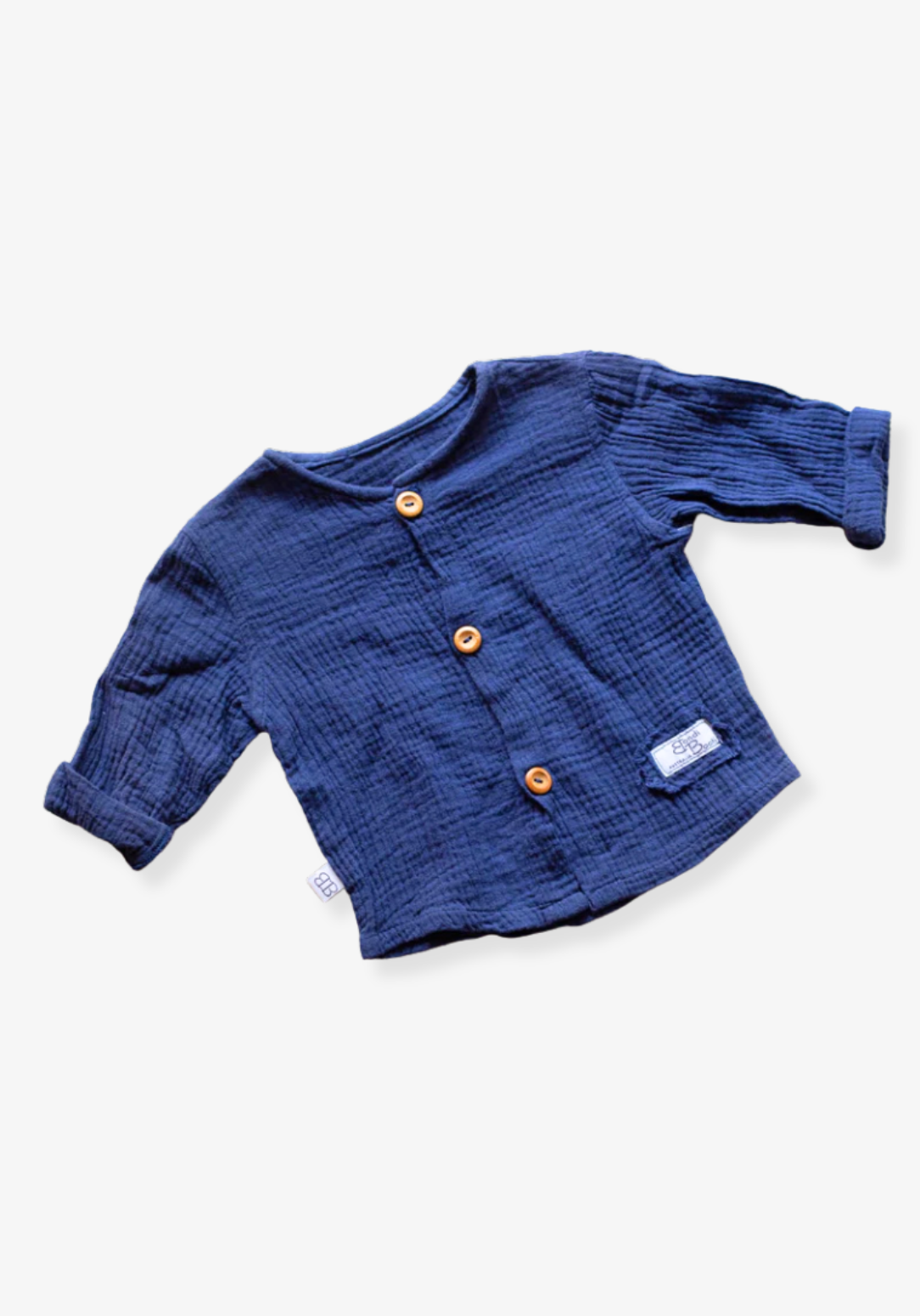 Navy island-style baby and toddler shirt made from organic cotton with wooden buttons and short sleeves