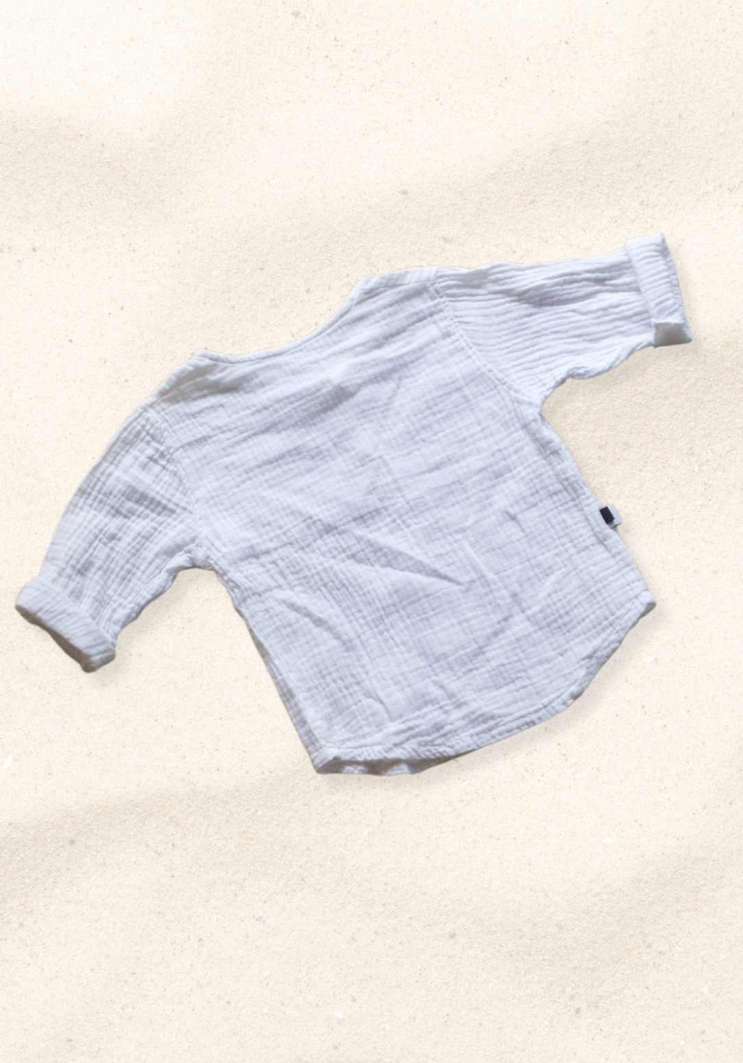 White island-style toddler shirt made of organic cotton, perfect for beachwear or everyday comfort.