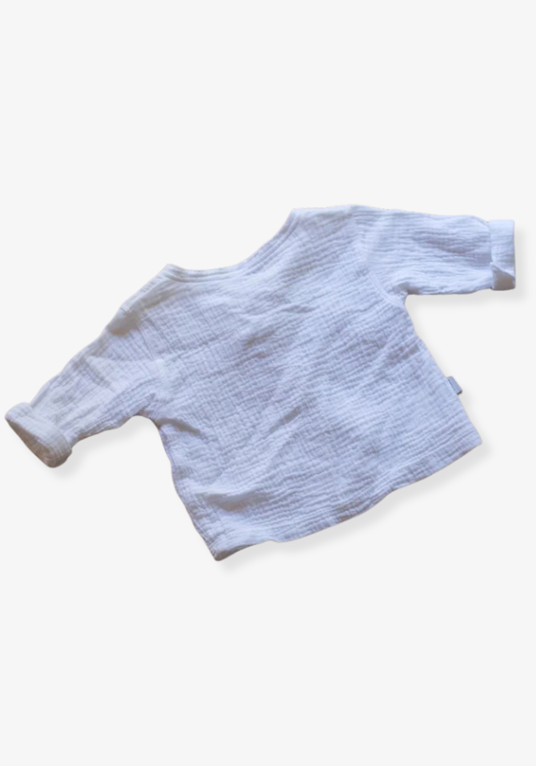 The Pirate Shirt in white made from organic cotton with wooden buttons, perfect for toddler casual wear