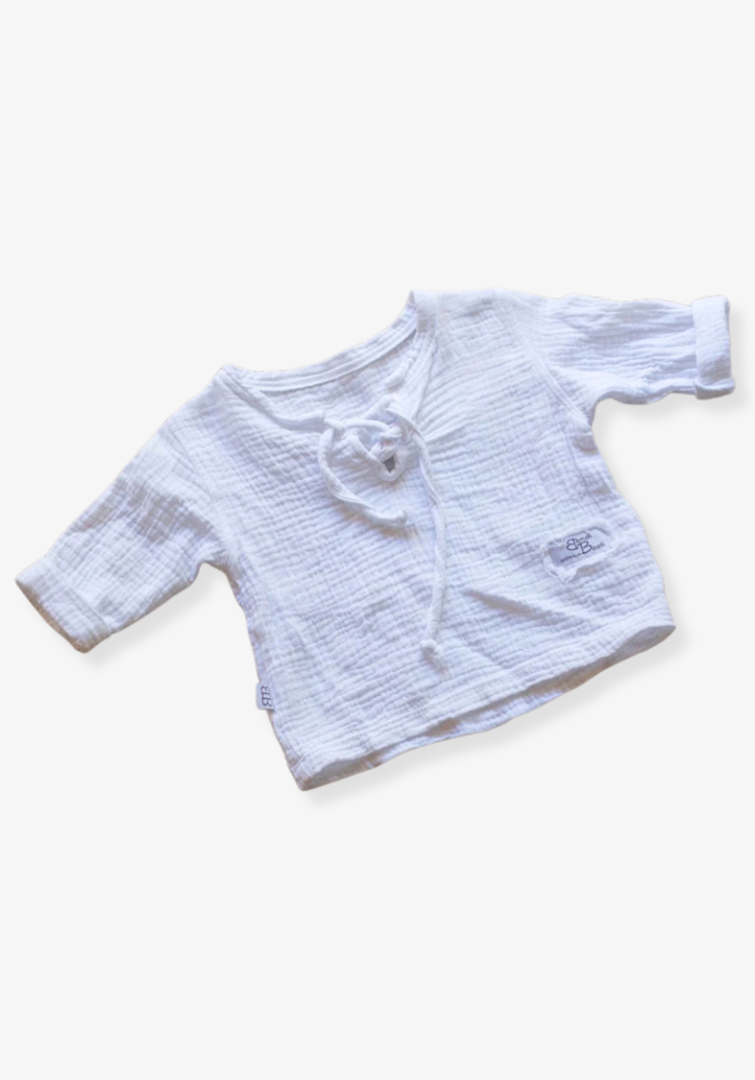 The Pirate Shirt in white made from organic cotton with wooden buttons, perfect for toddler casual wear