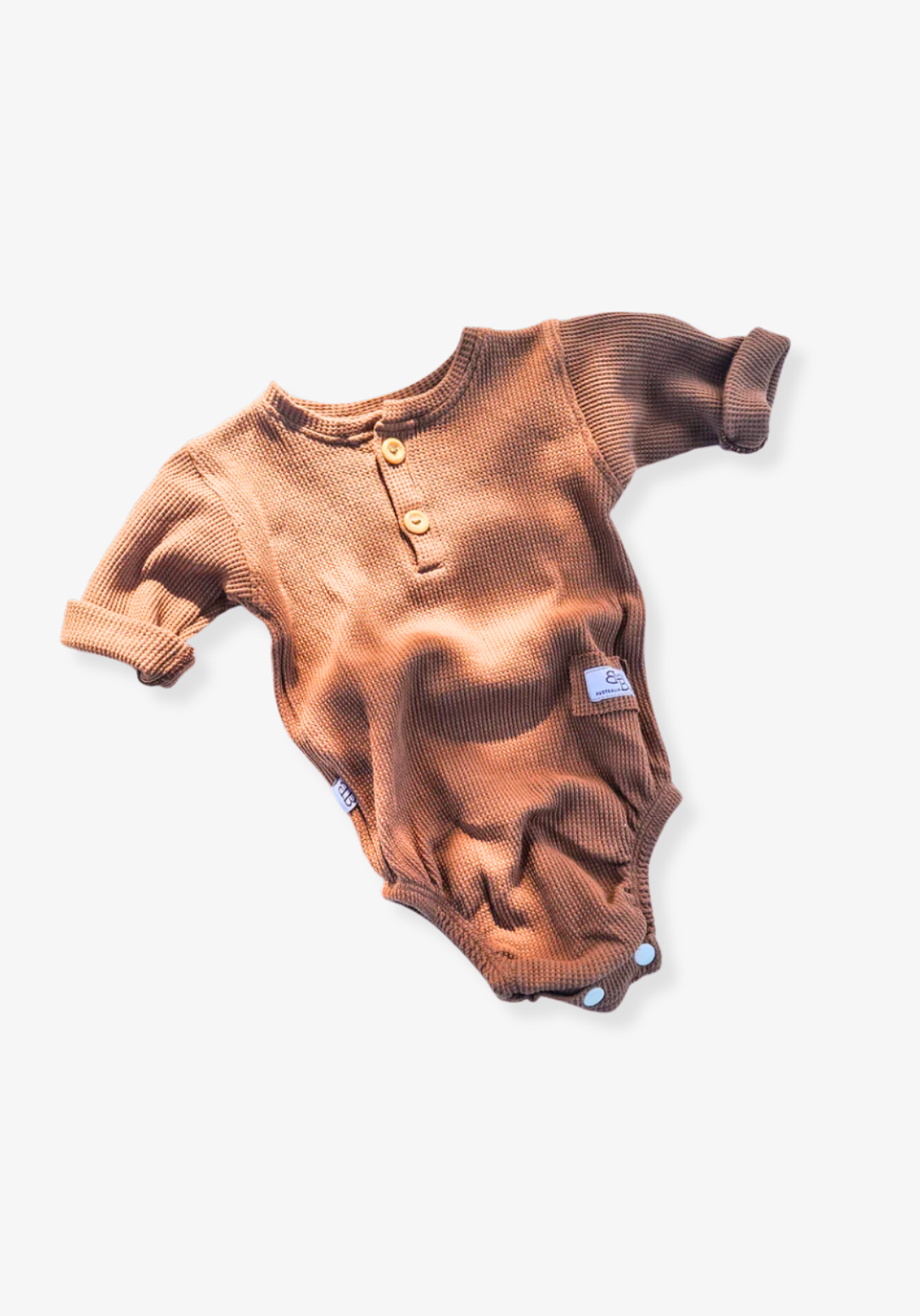 waffle knit long sleeve baby bodysuit with soft organic cotton texture and convenient snap buttons