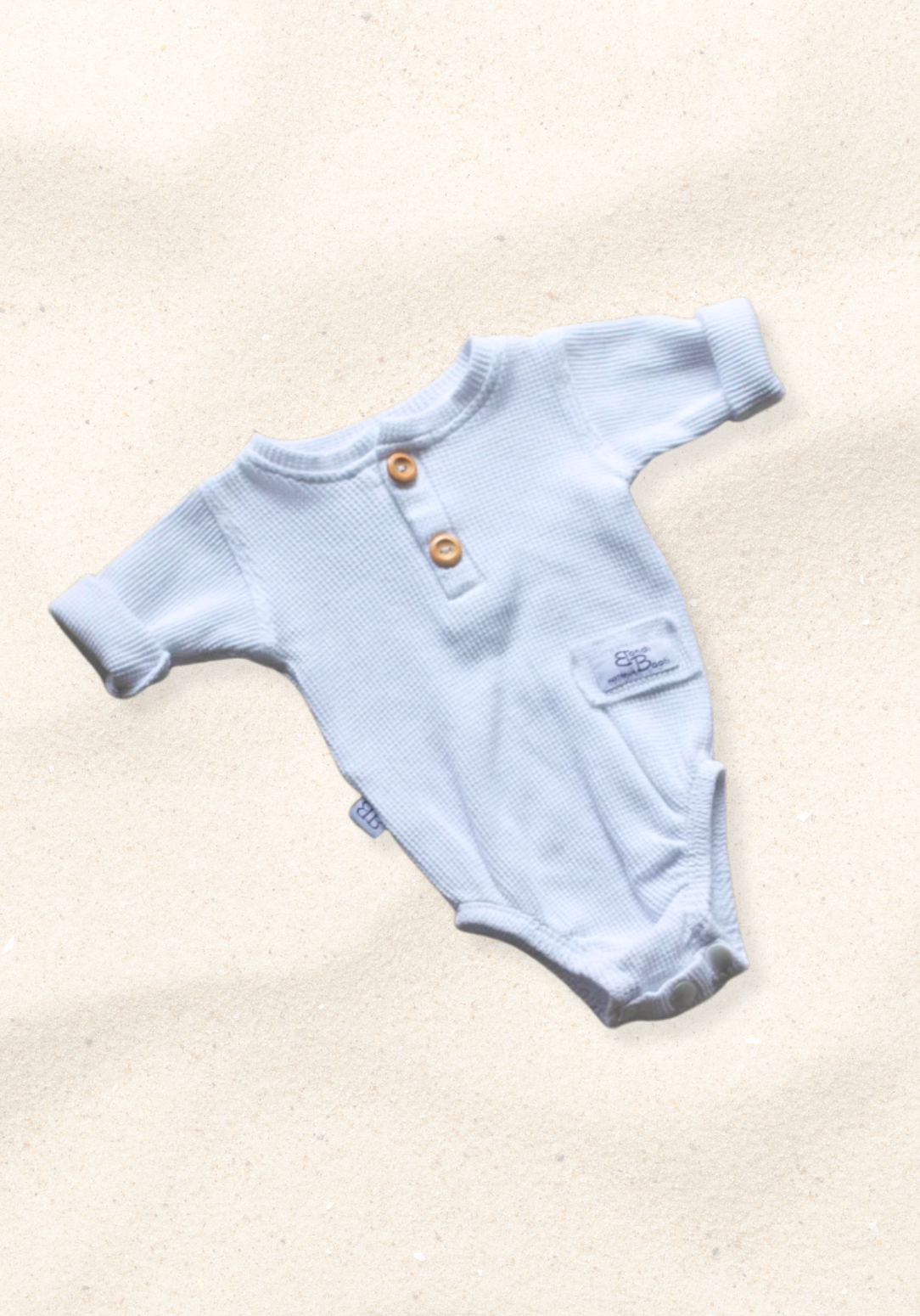 waffle knit long sleeve baby bodysuit with soft organic cotton texture and convenient snap buttons