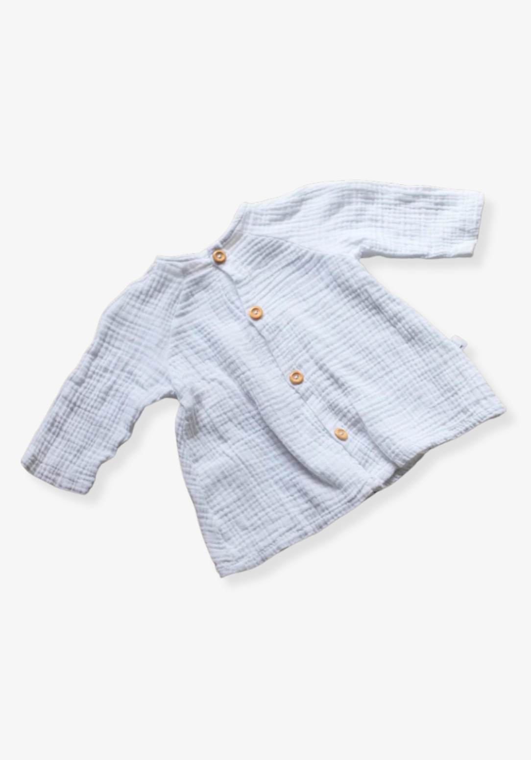 White cotton boho baby dress with elegant lace embroidery displayed on a soft grey background
